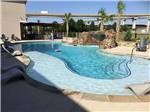 Swimming pool with a water fountain at LAKESHORE RV RESORT - thumbnail