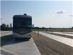 Front view of motorhome in campsite at FLATLAND RV PARK - thumbnail