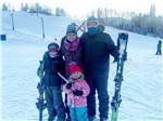 A family in snow & skiing gear at MONT DU LAC RESORT - thumbnail