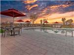 The swimming pool at sunset at RIVER SANDS RV RESORT - thumbnail