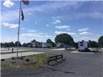 RV park with flags on a tall pole at KUMBERLAND CAMPGROUND - thumbnail