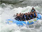 A group riding a large raft on the rapids near ALPINE VALLEY RV RESORT - thumbnail