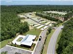 Aerial view of the office, swimming pool and sites at WHISPERING PINES RV RESORT EAST AND WEST - thumbnail