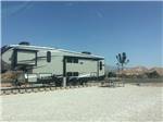 A fifth wheel trailer in an RV site at SAND HOLLOW RV RESORT - thumbnail