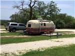 Camper and truck in a campsite at OFF THE VINE RV PARK - thumbnail