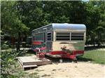 View of camper in a campsite at OFF THE VINE RV PARK - thumbnail