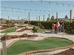 People playing on the miniature golf course at WALLICUT RIVER RV RESORT - thumbnail