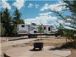 A fifth wheel trailer parked in a gravel site at LITTLE AMERICA RV PARK - thumbnail