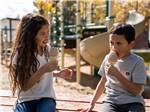 The young girl and boy enjoying ice cream cones at LITTLE AMERICA RV PARK - thumbnail