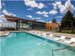 The swimming pool with lounge chairs at VILLAGE CAMP FLAGSTAFF - thumbnail