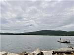 A man standing at the end of the dock at HTR ACADIA - thumbnail