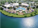 A rendering photo of the swimming pool and lake at OLDE FLORIDA MOTORCOACH RESORT - thumbnail