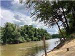 A view of the river from the sand at CHICKASAWHAY RIVER RV PARK - thumbnail