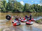 People on the river inner tubing at CHICKASAWHAY RIVER RV PARK - thumbnail
