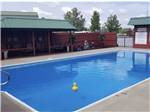 Swimming pool at lodge at DUCK CREEK RV PARK - thumbnail