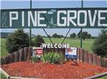 Welcome sign at entrance at PINE GROVE RV PARK - thumbnail