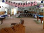 Dining area with pool table at CLOUD NINE RV PARK - thumbnail