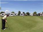 A couple of people playing golf at DEER PARK RV RESORT - thumbnail