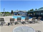 Lounge chairs around the pool at DEER PARK RV RESORT - thumbnail