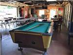 A pool table and seating at COUNTRYSIDE CAMPGROUND - thumbnail