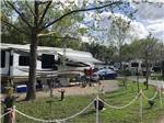 Large trailer with grassy area at LAKE CITY RV RESORT - thumbnail