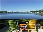Chairs overlooking the water at CRYSTAL LAKE RV RESORT - thumbnail