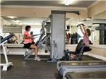 2 women exercising in the exercise room at BEYONDER RESORT CAJUN MOON - thumbnail
