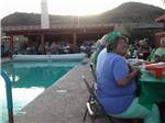 A party next to the pool at PHOENIX METRO RV PARK - thumbnail