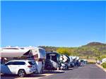 RV campground with hill in the background at PHOENIX METRO RV PARK - thumbnail