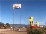 Entrance sign and giant boots at BOOT HILL RV RESORT - thumbnail