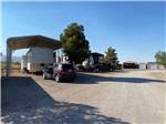A row of covered RV sites at BOOT HILL RV RESORT - thumbnail