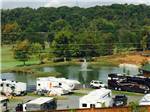 RVs camping near pond with fountain at THE CREEKS GOLF & RV RESORT - thumbnail