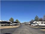 Paved road leading to paved RV sites at THE CREEKS GOLF & RV RESORT - thumbnail