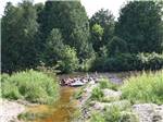 A group of people inner tubing down the river at SAUGEEN SPRINGS RV PARK - thumbnail