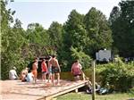 Bathers gathered near stairs leading to water at SAUGEEN SPRINGS RV PARK - thumbnail