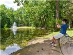 Boy fishing on lake at THOUSAND TRAILS RONDOUT VALLEY - thumbnail