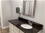 The clean bathroom sink at TWELVE OAKS RV PARK - thumbnail