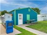 Blue building with mail boxes along the side at K & R RV PARK - thumbnail