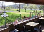 A sitting area overlooking the golf course at Y KNOT WINERY & RV PARK - thumbnail