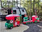 RV space adorned with Christmas decorations at OCEAN CITY CAMPGROUND AND BEACH CABINS - thumbnail