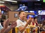 People clapping at the sports bar at LITTLE RIVER CASINO RESORT RV PARK - thumbnail