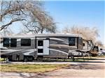A row of trailers parked at KENWOOD RV RESORT - thumbnail