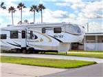 A fifth wheel parked on-site at SNOW TO SUN RV RESORT - thumbnail