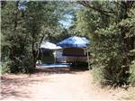 A popup trailer in a RV site at PAYSON CAMPGROUND AND RV RESORT - thumbnail