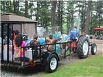 Group of children on a tractor ride at STATELINE CAMPRESORT & CABINS - thumbnail
