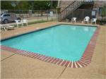 The pool and some chairs at CARTHAGE RV CAMPGROUND - thumbnail