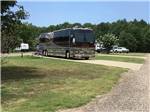 Motorhome in a pull thru site at CARTHAGE RV CAMPGROUND - thumbnail
