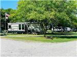 Fork in the road with campers in campsites at NEW VISION RV PARK - thumbnail