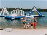 A family getting ready to go into the water at WILLOWTREE RV RESORT & CAMPGROUND - thumbnail