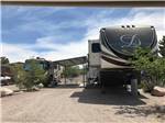 The front of a gravel RV site at CEDAR COVE RV PARK - thumbnail